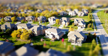 Miniature model of a housing development, with houses, trees and gardens